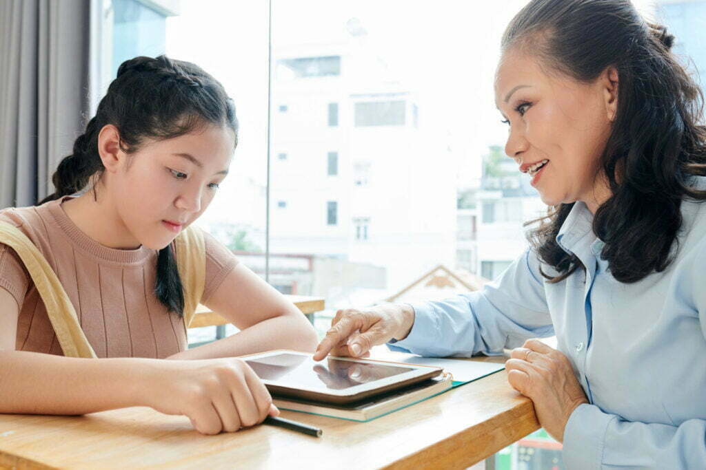 Tutor explaining a topic to a student, illustrating effective math tutoring strategies.