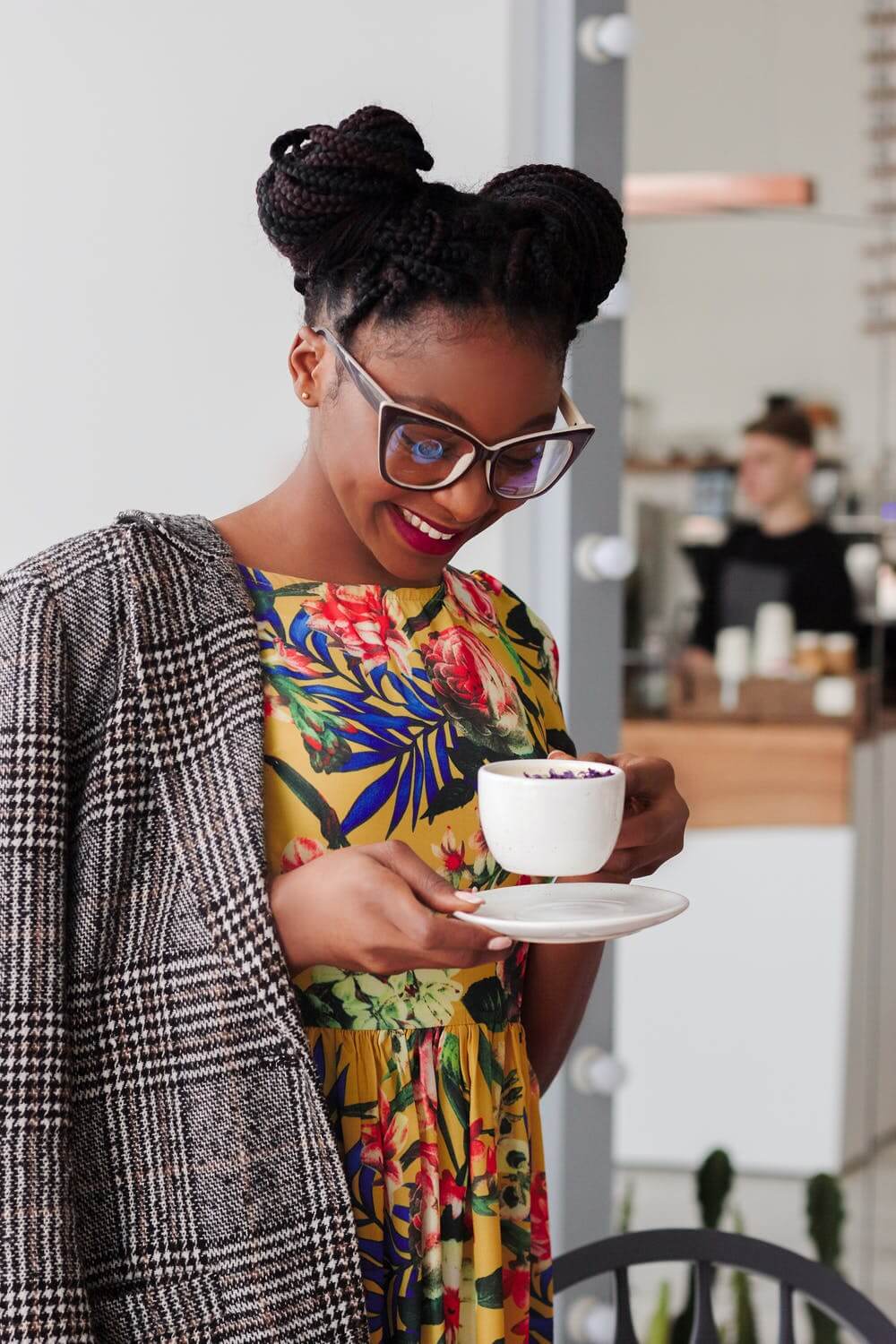 a person holding a cup of tea