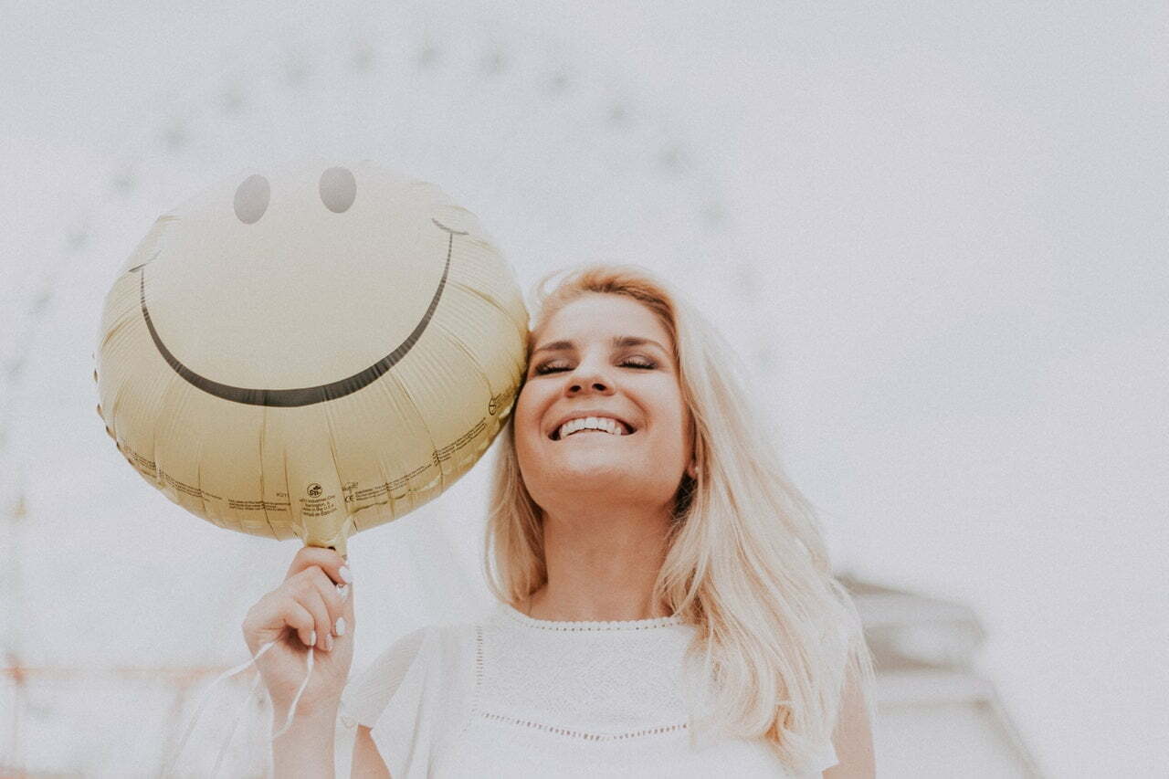 a person holding a balloon