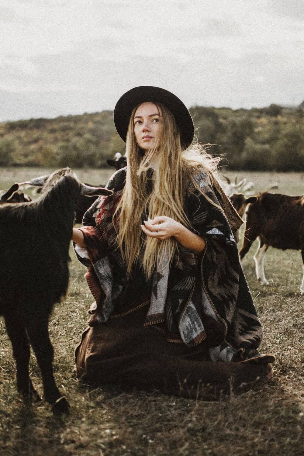 a woman sitting on a horse