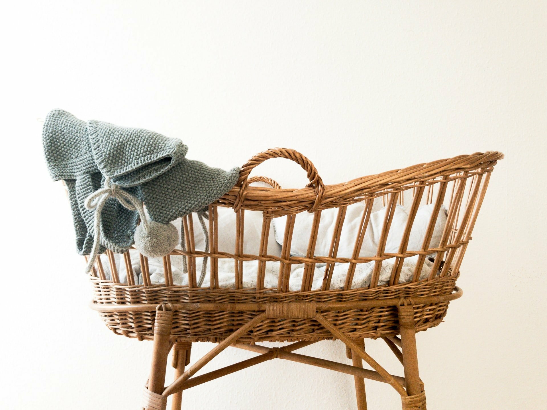 a wicker chair with a towel on it
