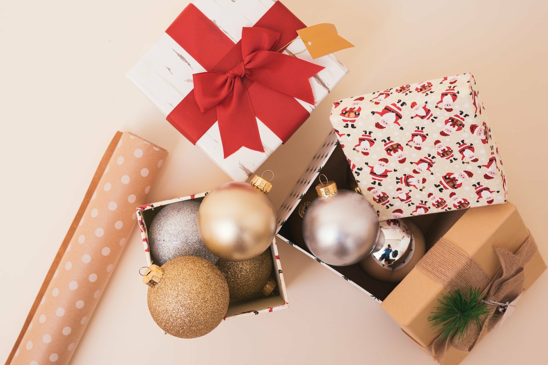 a gift box with a red bow and a white and brown present