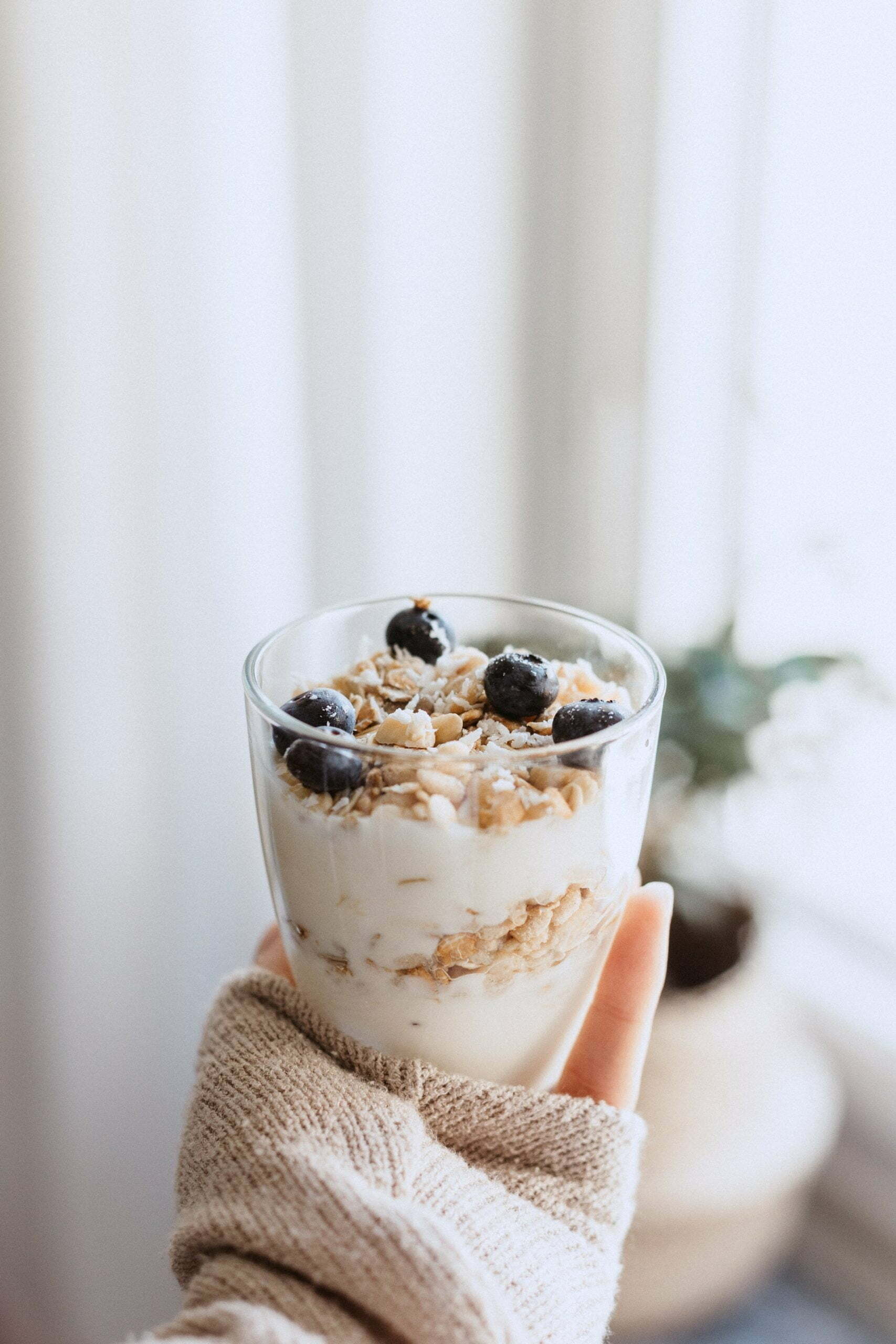 a person holding a dessert