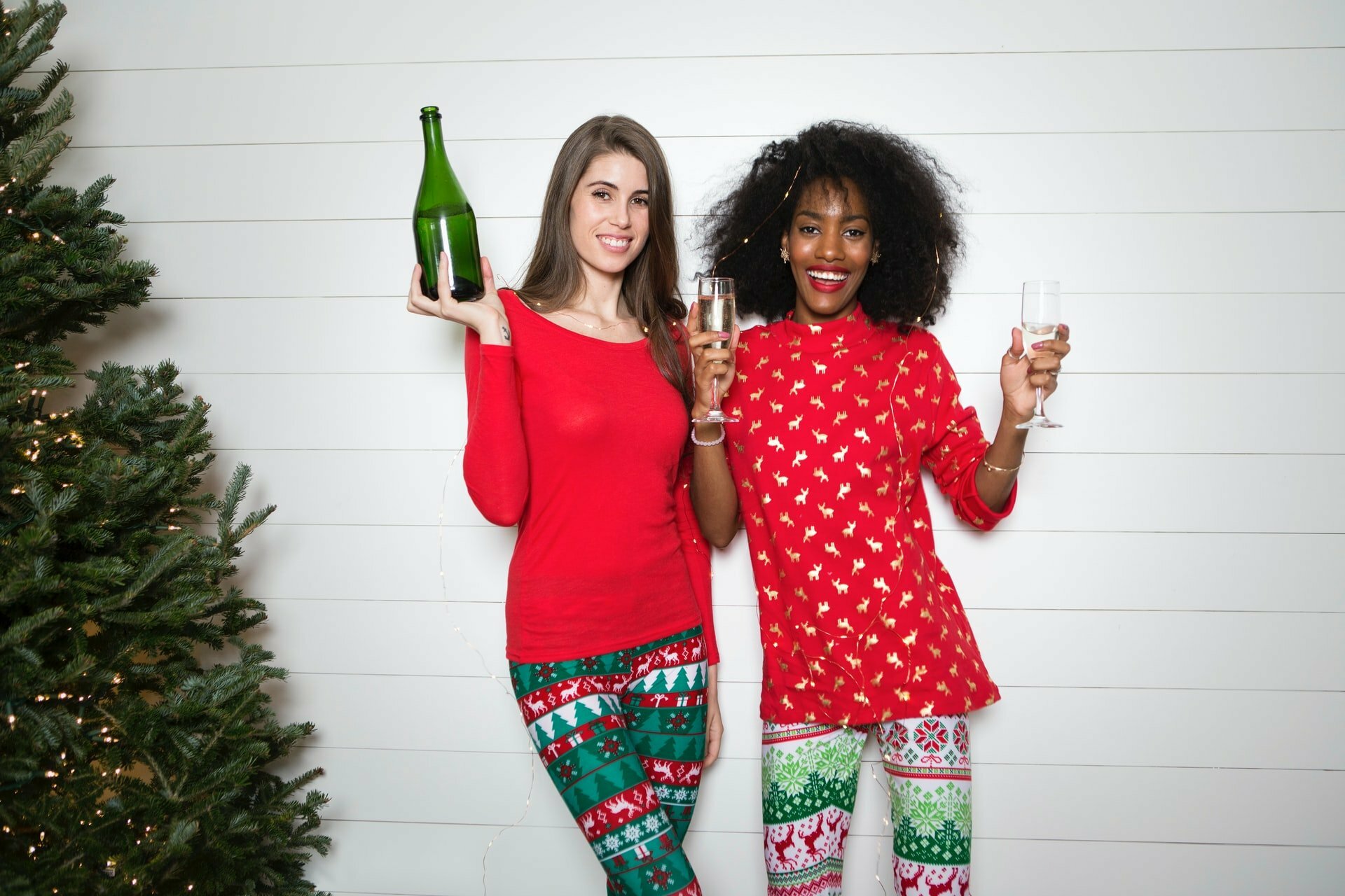 a couple of women holding wine glasses
