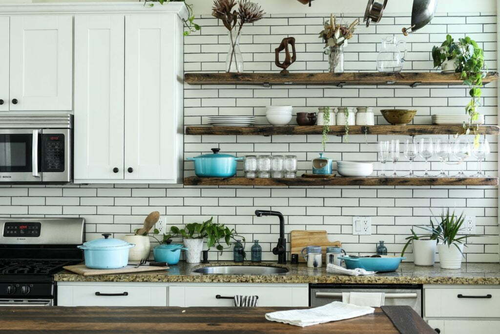 a kitchen with white cabinets
