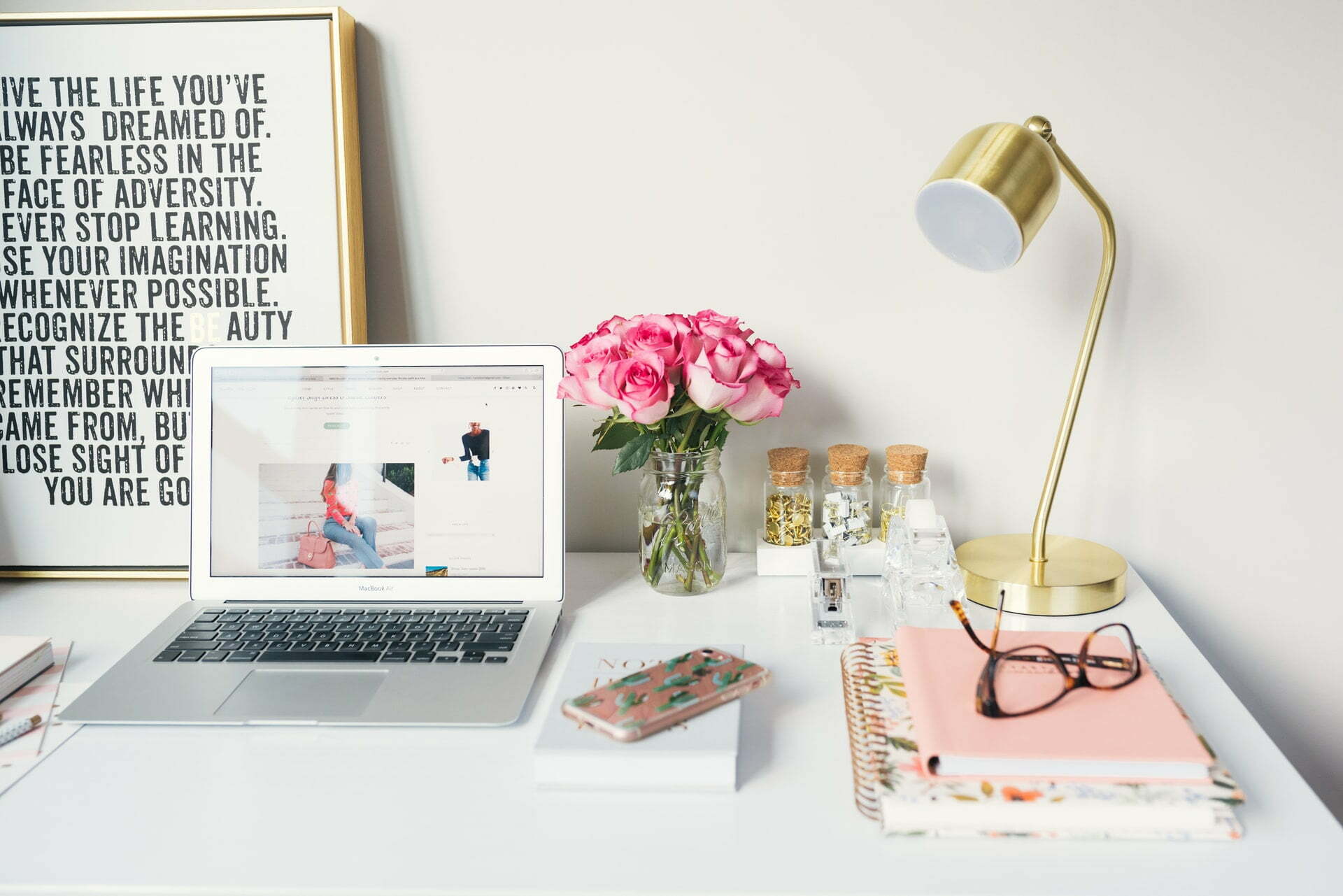 a laptop and a lamp on a table