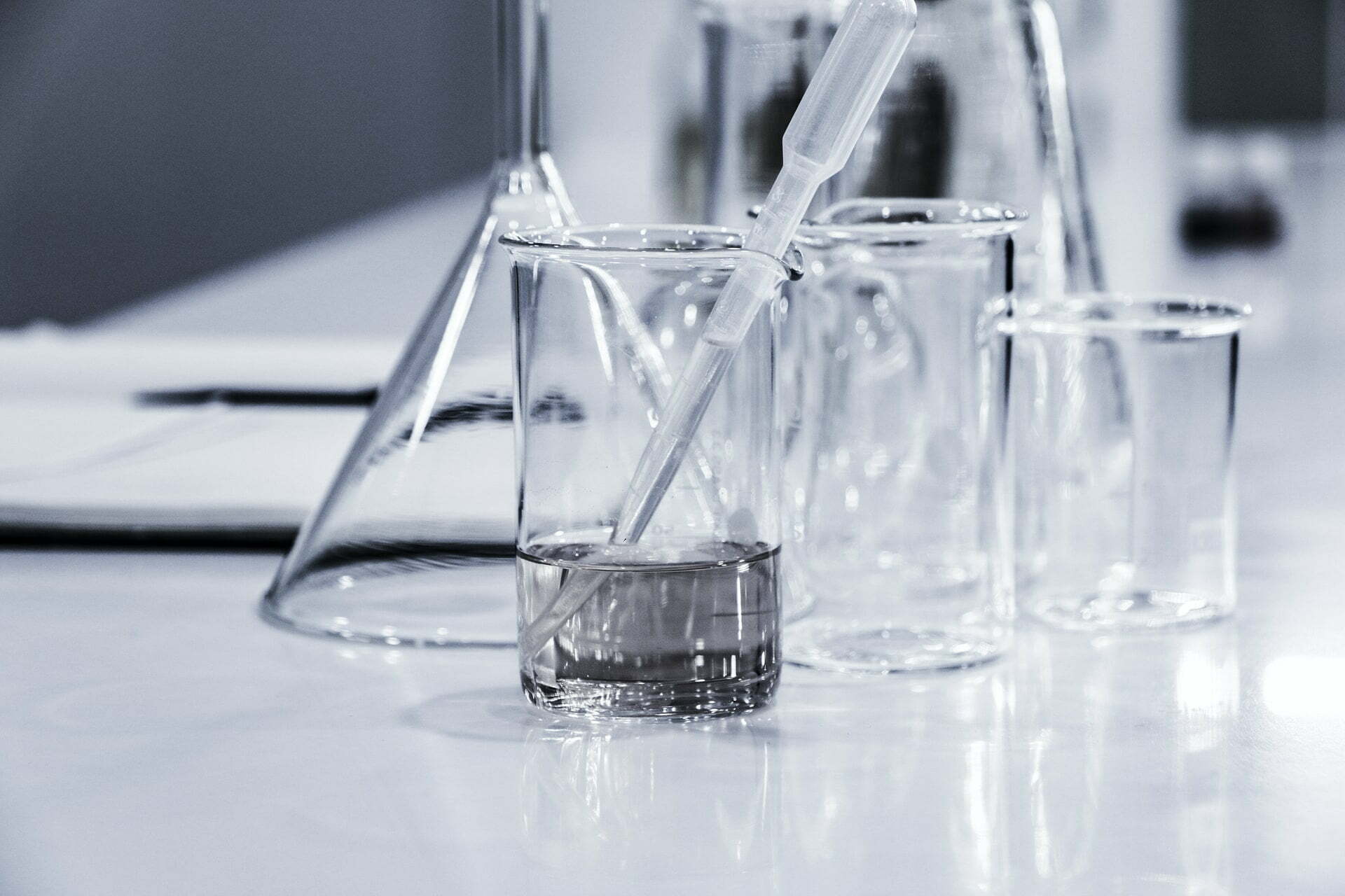 a glass of water being poured into a glass